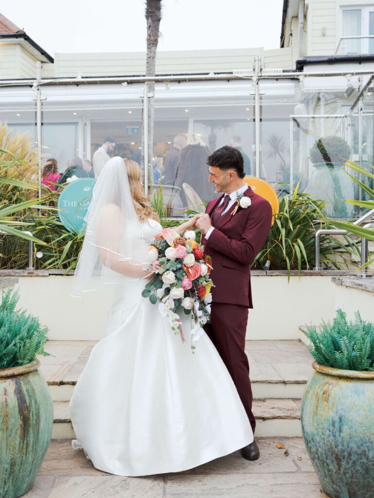 Bride and groom portraits outside the Roslin Hotel in Southend during their seaside wedding.